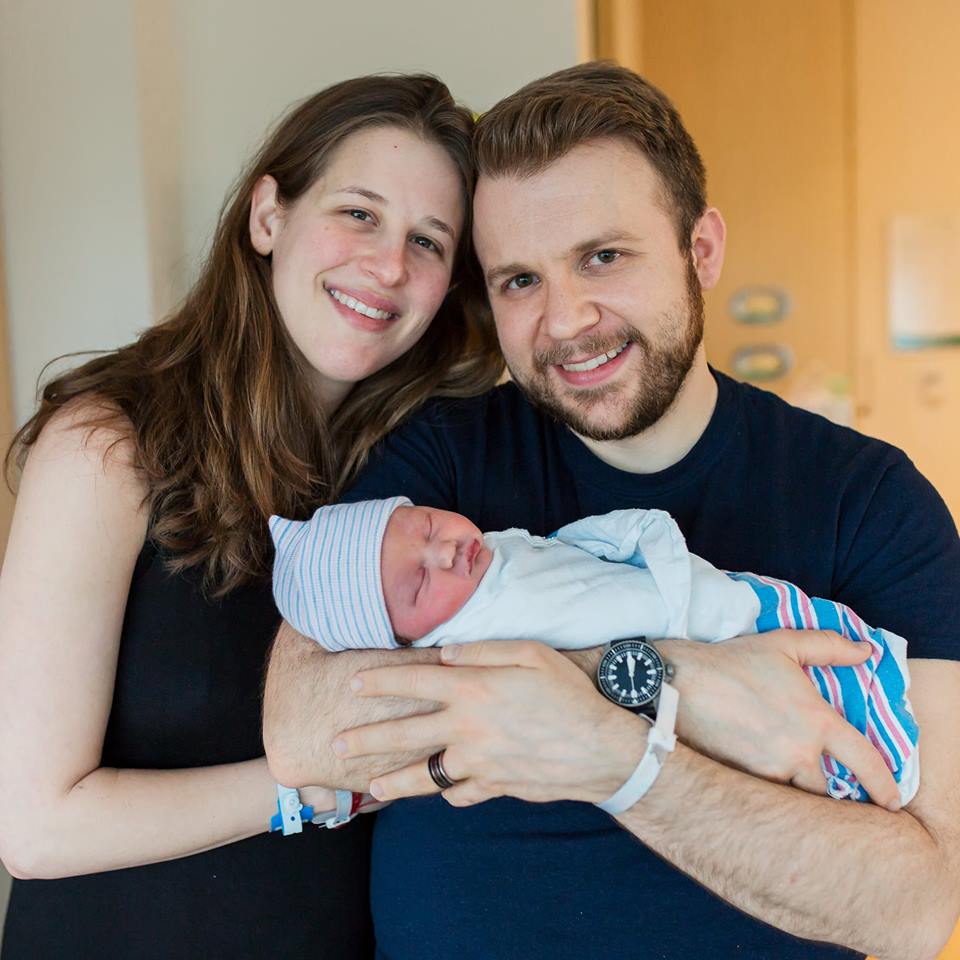 Greg and Nora Boccuti, clients of Tribe of Mine, hold their newborn baby